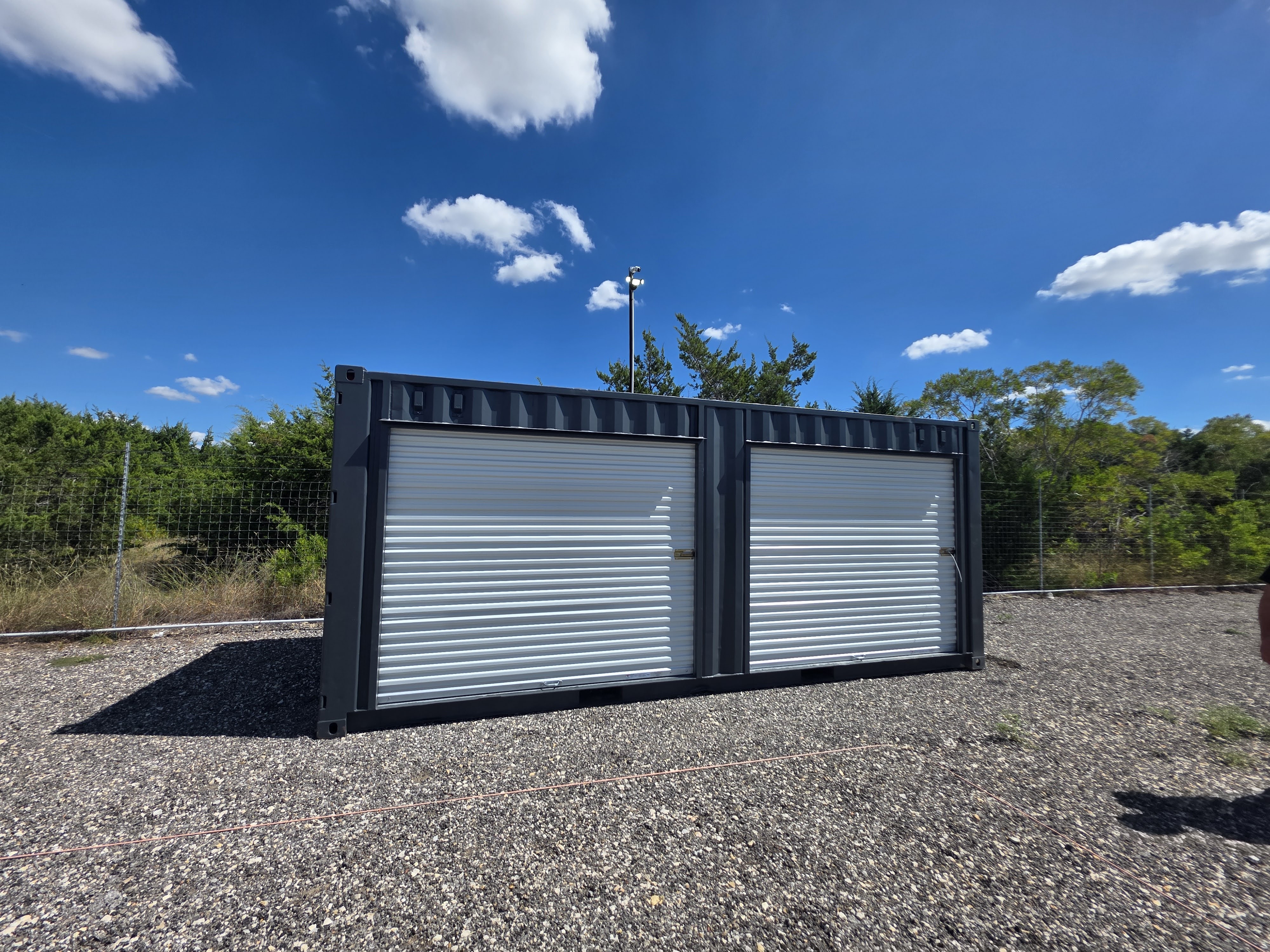 20 foot shipping container conversion with roll-up door