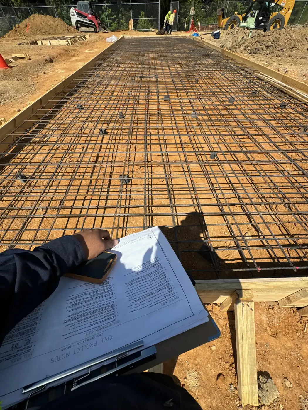 Commercial concrete slab preparation with rebar grid before pour
