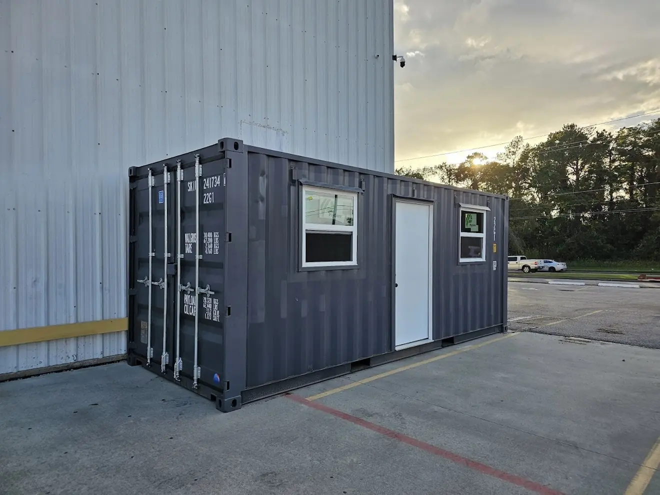 Modified container with steel access door