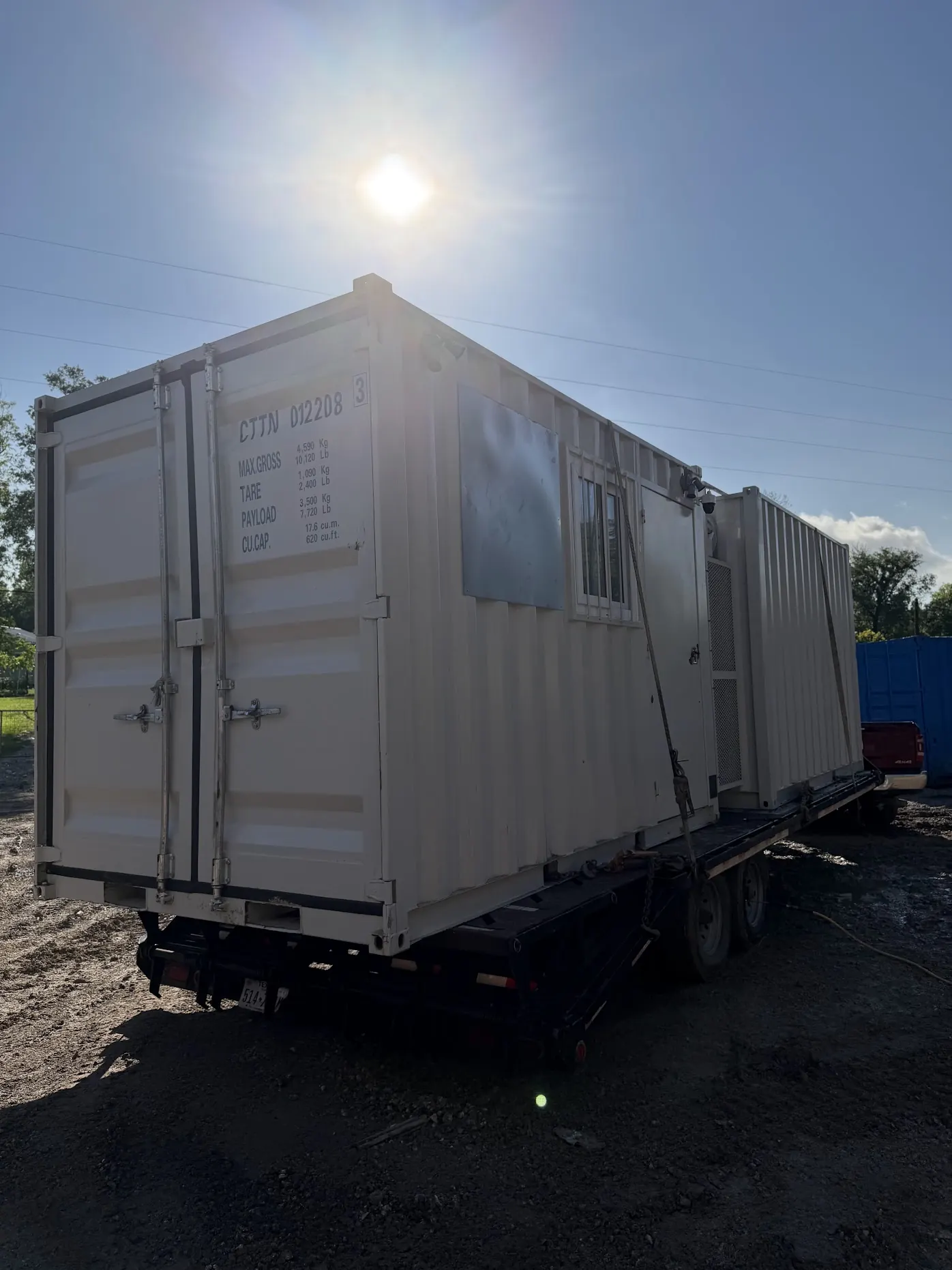 Equipment container loaded for delivery