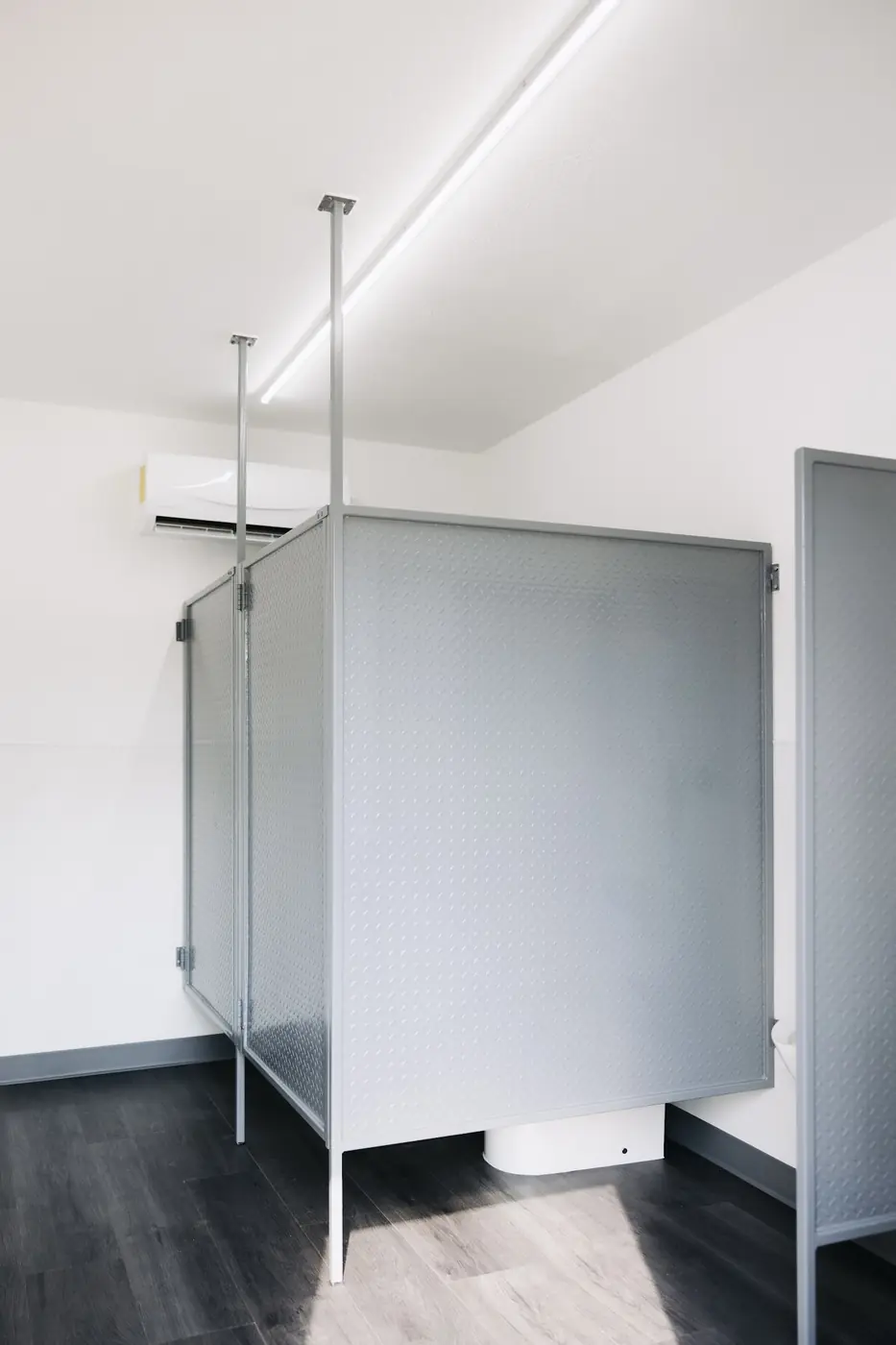 Shower and changing stalls inside a container build