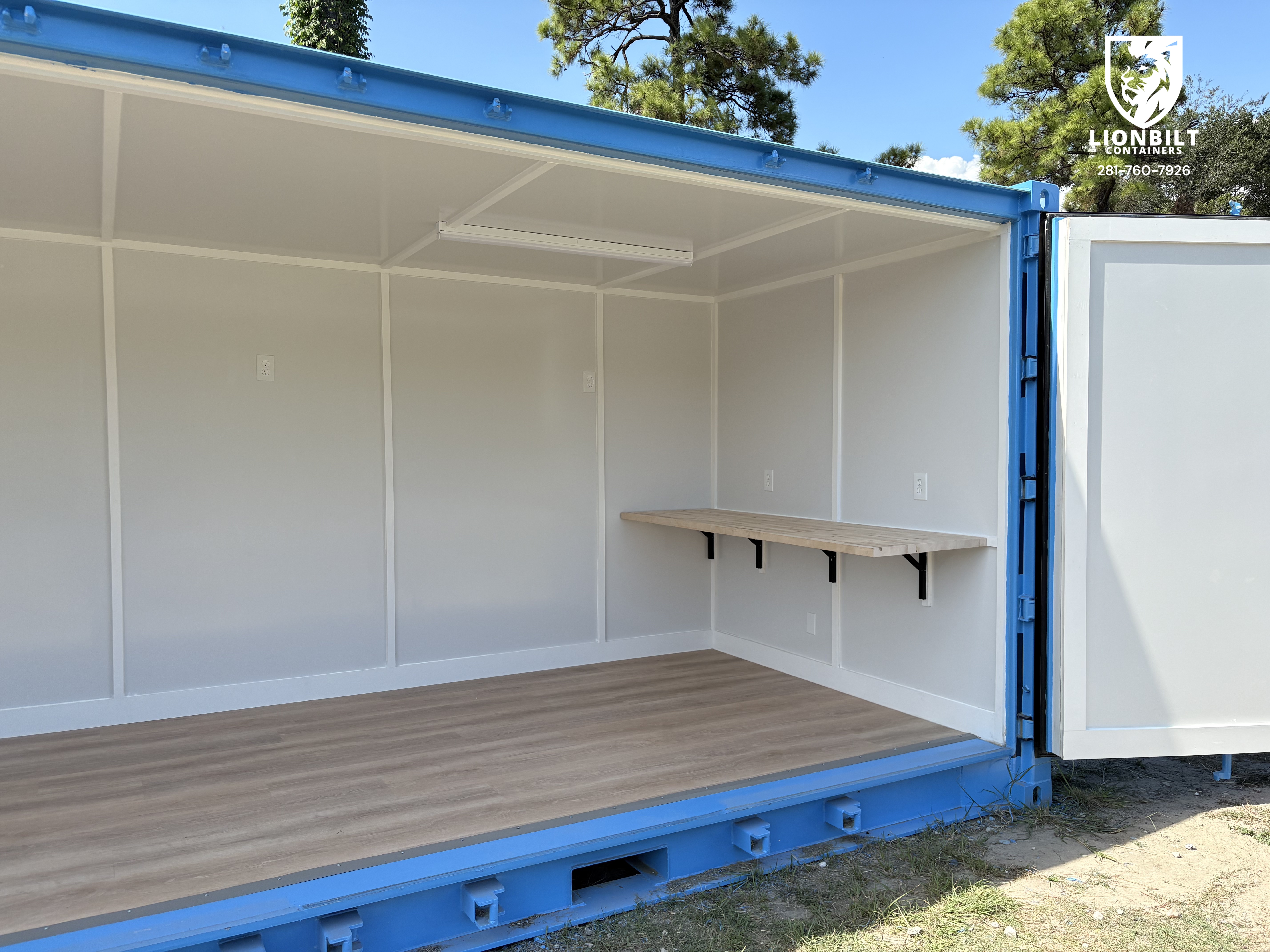 Custom shipping container exterior paint black and blue, angle view 2